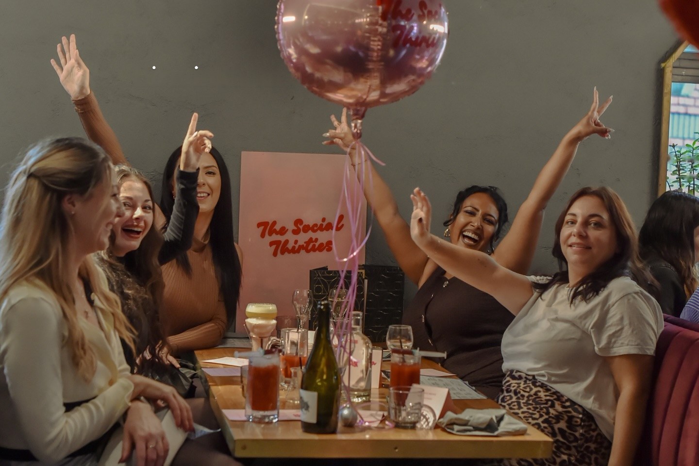 Members celebrating at a Social Thirties brunch